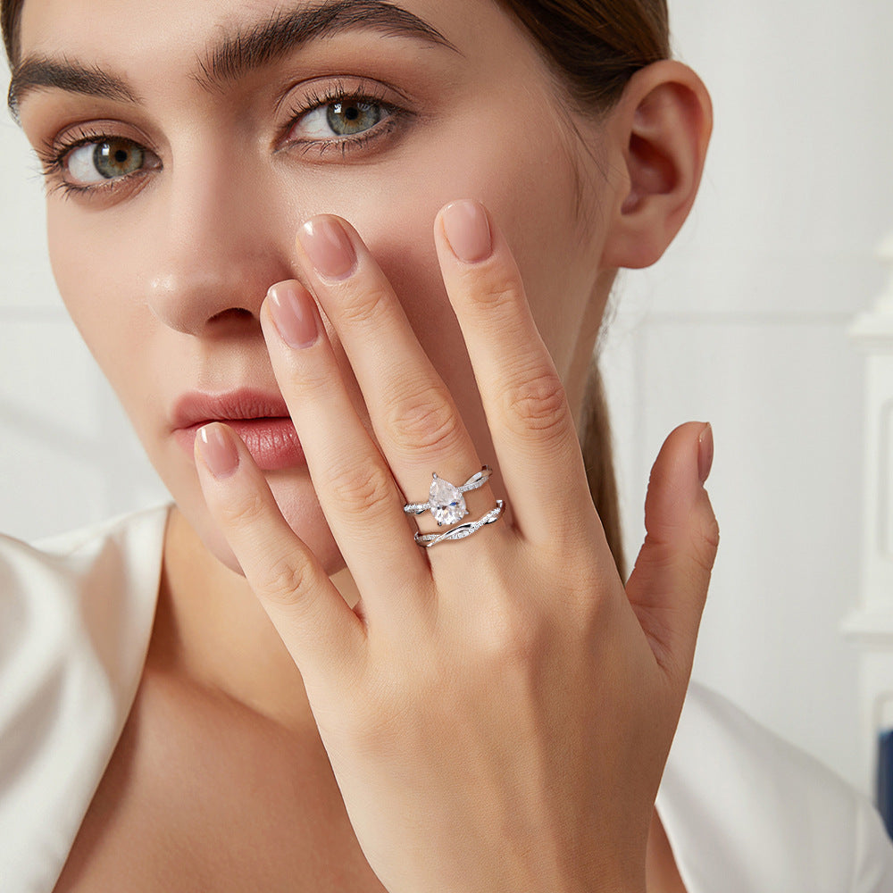 #125 VNK Luxury 2CT Pear Moissanite Ring | Twisted Band with 0.23CT Luminous Accents