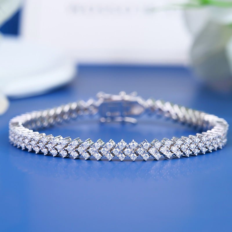 154 VANNICK Cross-over Moissanite Tennis Bracelet in 925 Sterling Silver - VANNICK