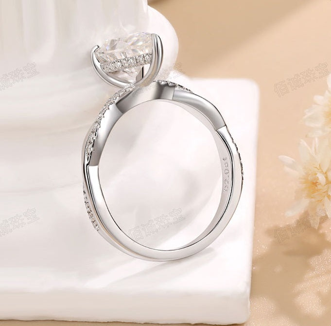 #125 VNK Luxury 2CT Pear Moissanite Ring | Twisted Band with 0.23CT Luminous Accents