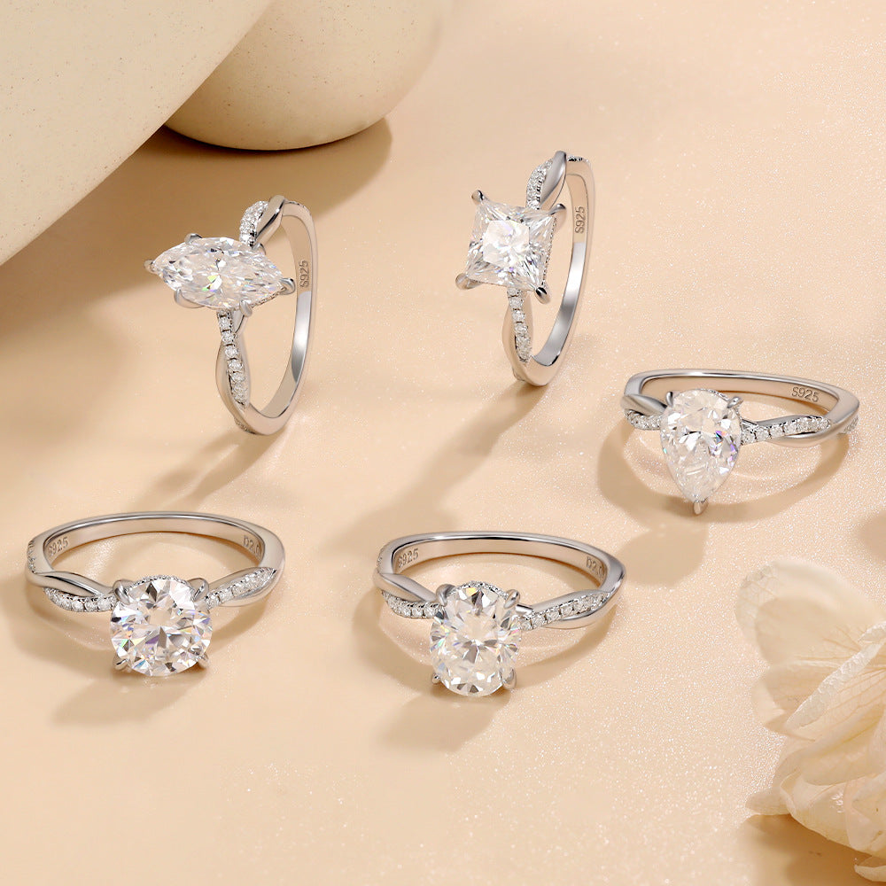 #125 VNK Luxury 2CT Pear Moissanite Ring | Twisted Band with 0.23CT Luminous Accents