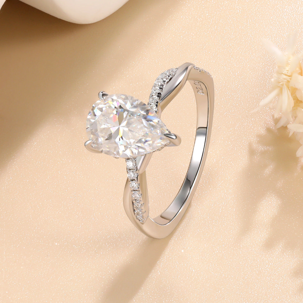 #125 VNK Luxury 2CT Pear Moissanite Ring | Twisted Band with 0.23CT Luminous Accents