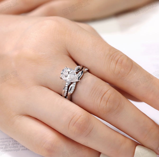 #125 VNK Luxury 2CT Pear Moissanite Ring | Twisted Band with 0.23CT Luminous Accents