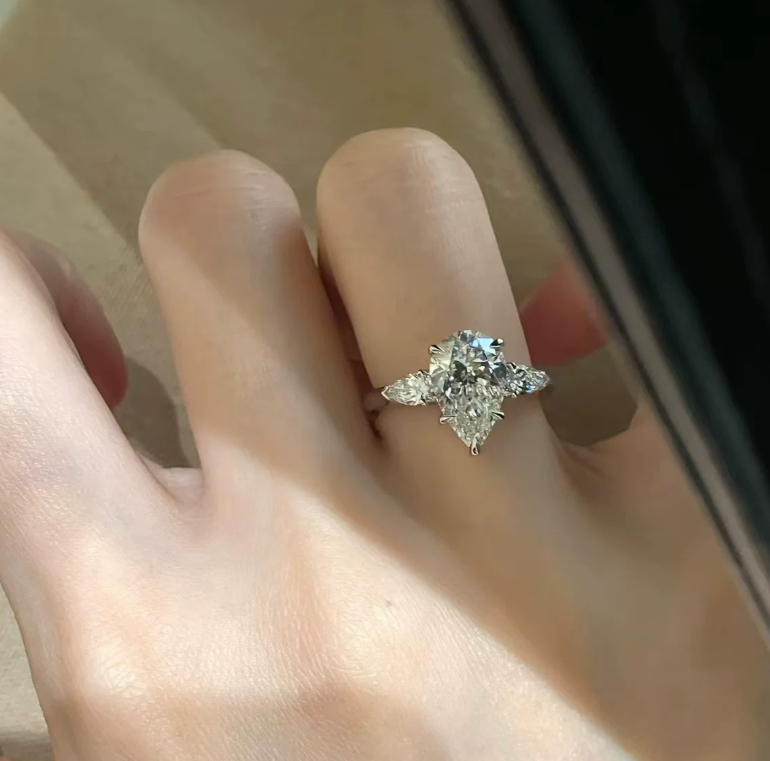 #124 VNK Luxury 4 Carat Pear Moissanite Three-Stone Ring | Timeless Side Accent Design